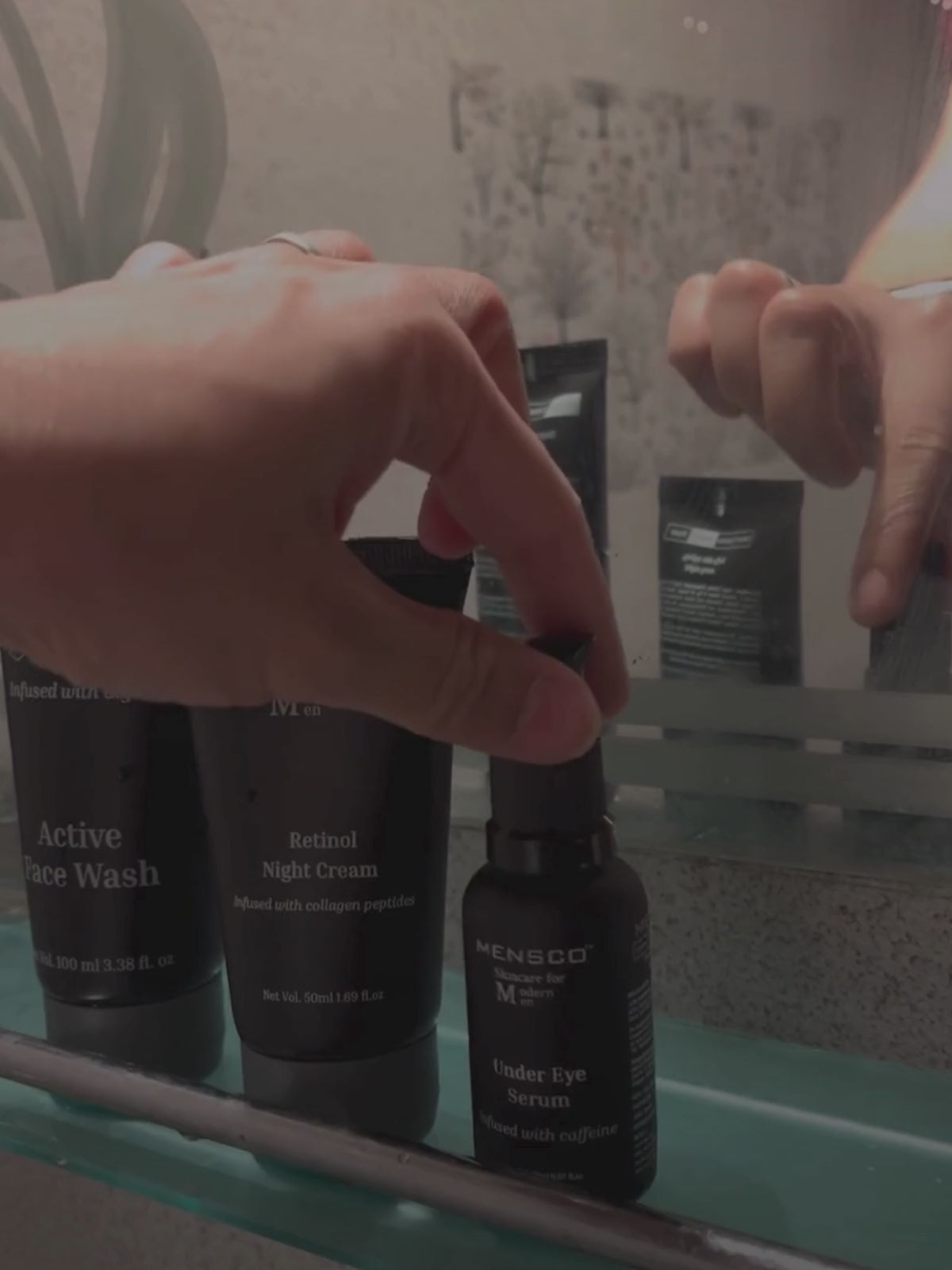 “Men applying caffeine under eye serum to brighten dark circles and smooth fine lines”